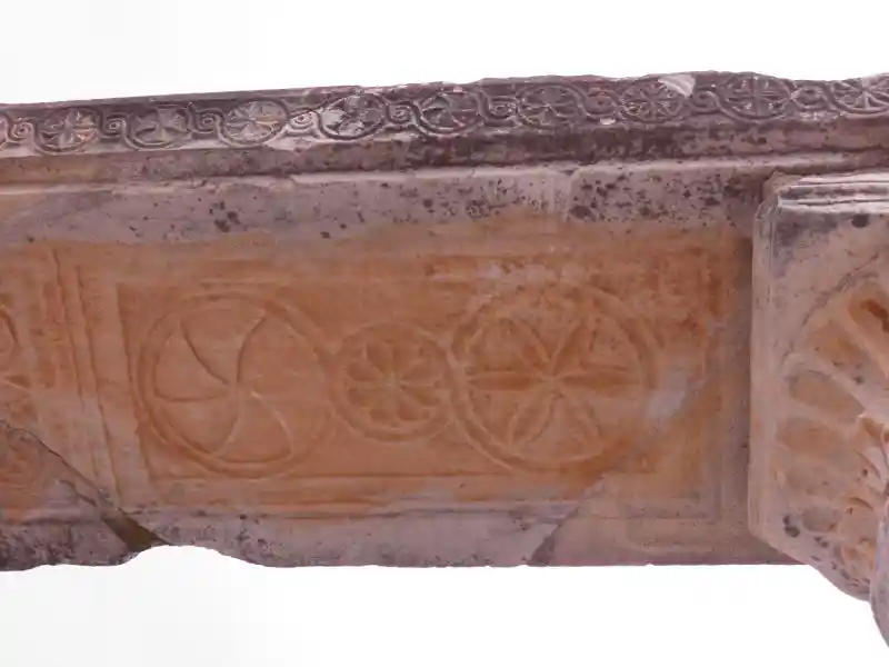 Solar discs engraved on a stone pillar at the church of Mary